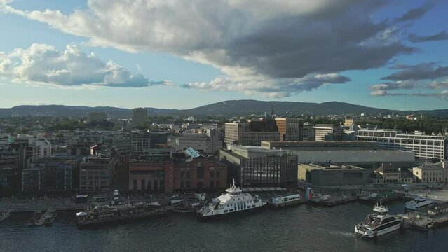 Panning left along the waterfront properties of Aker Brygge in Oslo