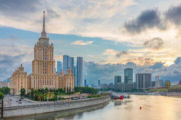 High-rise stalinist building near river at summer sunset in Moscow, Russia. Historic name is Hotel Ukraine.