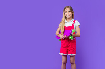 teen girl skateboarder in studio, copy space. teen girl skateboarder on background. teen girl skateboarder. teen girl skateboarder isolated on purple.