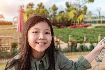 Cute Little Asian Girl, smile, in Garden.
