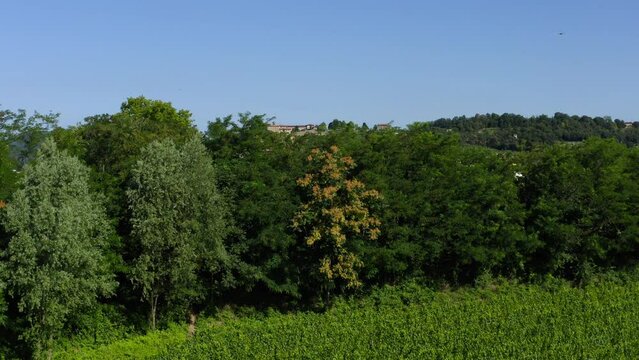 Reveal view of Paratico town and comune in Brescia province of Lombardy, Italy. Aerial drone rising