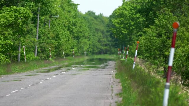 
Hokkaido, Japan - June 8, 2023: Road mirage or water mirage or inferior mirage on a road in Betsukai, Hokkaido, Japan

