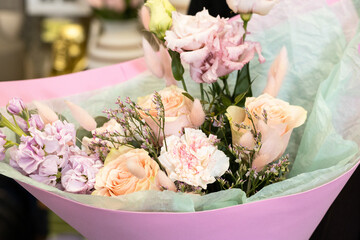 Floristry. Flowers. Multicolored bouquet of roses, soft focus.