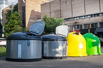 sorting trash cans on the street in the city on a sunny day. Ecology and care for the environment