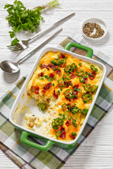 Loaded smashed potatoes with cheese, bacon, cream