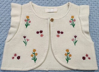 Floral embroidered and ruffles Trims bolero shape knitwear girls sweater vest and vest cardigan  - obrazy, fototapety, plakaty