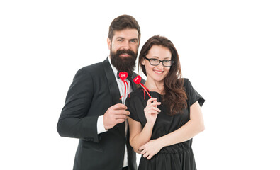 Family couple. Bearded man in tuxedo hug elegant woman. Proposal and engagement. Married couple hold red hearts. Happy relationship concept. Trustful relations. Happy valentines day. Couple in love
