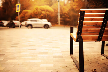 Taking a rest on a wooden bench in the park during autumn season