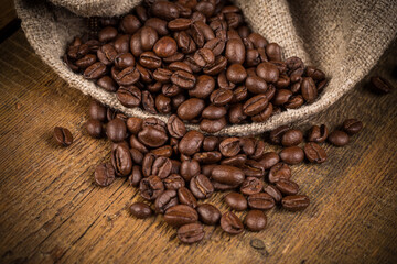 Coffee beans on grunge wooden background