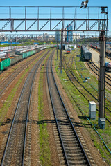 Fototapeta premium Station railway tracks on a summer day