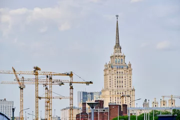 Zelfklevend Fotobehang High rise construction cranes background Stalin high rise in Moscow. © freeman83