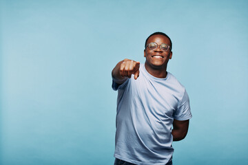 Smiling African man pointing at the camera