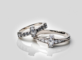 Diamond platinum rings on white background.