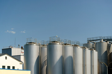 Agricultural silos for storage of grain harvest at an agricultural production farm © uladzimirzuyeu