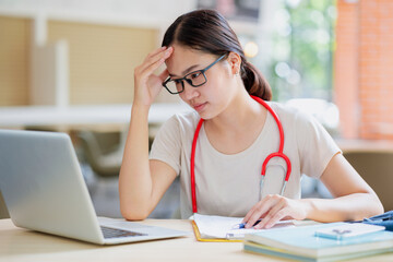 Young medical student worry stress about patient clinical case consult study education at medical school.