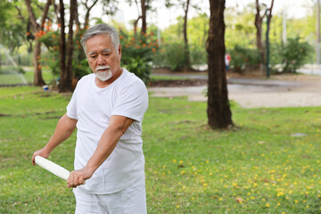 Asian senior man practice yoga excercise, tai chi tranining, stretching and meditation together...