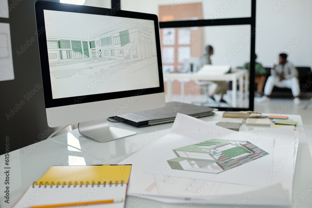 Aufkleber Computer monitor with architectural sketches on screen standing on workplace of building designer with blueprint and open notebook