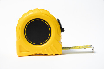 tape measure isolated on white. studio photo of a tape measure on a white background. yellow tape measure