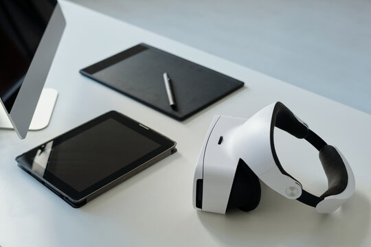 Group of objects necessary for work of webdesigner or graphic designer, vr headset, touchpad with stylus, tablet and computer monitor