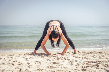Fitness Girl working out on the beach