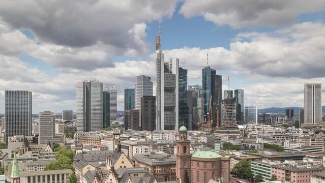 Time lapse of the futuristic skyline of the business and financial centre of Frankfurt am Main in Germany, Europe.