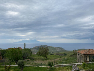 Rural village and sea view from Eski Bademli- Gliki village in Gokceada on a rainy day