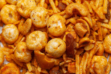 Close-up of Indian Spicy Chatpata Mixture of makhana and dry fruits namkeen. Front view.
