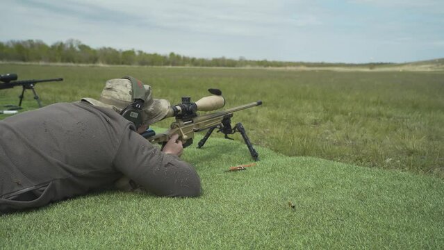 a shooter shoots at a target in a high-precision shooting competition