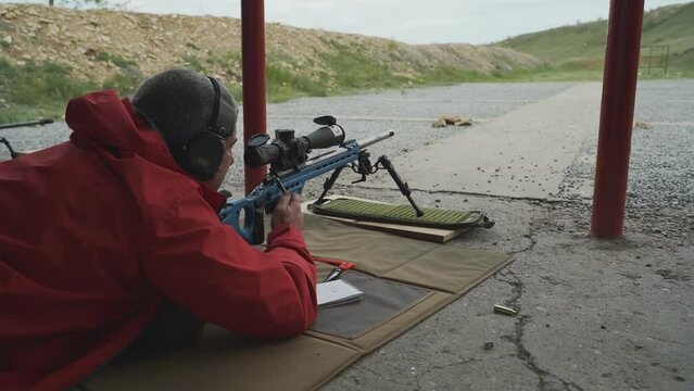 a sniper shoots at a target in a high-precision shooting competition