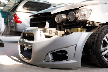 Car crash or accident parked at service center Front fender damage and scratches on the car body...