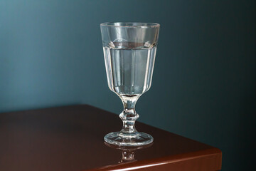 Glass wineglass of fresh mineral water on table