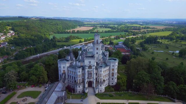 astle In the shade. Fantastic aerial top view flight. Fairy tale castle in Czech Republic Europe, summer day 2023. fly reverse drone
4K cinematic.