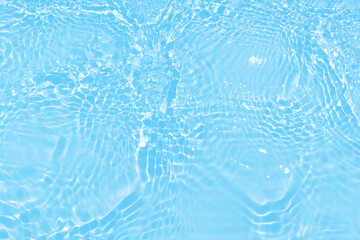 Blue water with ripples on the surface. Defocus blurred transparent blue colored clear calm water...
