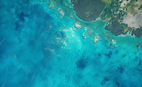 aerial view of a turquoise blue ocean, capturing the beauty and vastness of water.  Generative AI