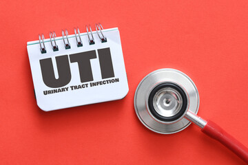 UTI Urinary Tract Infection words on a piece of paper.