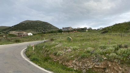 Asphalt entrance road of Gokceada Old Bademli village. Canakkale, Turkey