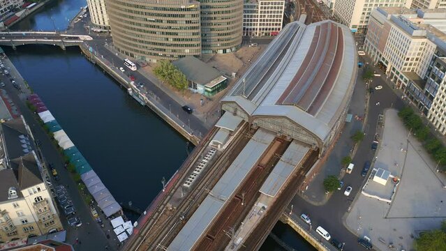 Train Station Friedrichstra&szlig;e Restaurant at spree River Palace of Tears. Gorgeous aerial top view flight 
Berlin city downtown Germany in Europe, summer day 2023. bird's eye view drone
4K cinematic.