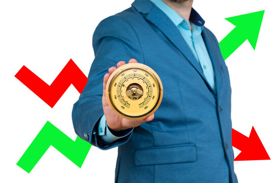 A businessman holds a barometer in his hands against the background of a red and green arrow. Risk, fluctuation in stock market and cryptocurrency.