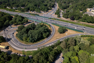 Aerial overview of transit roundabout intersection near Utrecht in Dutch landscape. Infrastructure and urban transportation