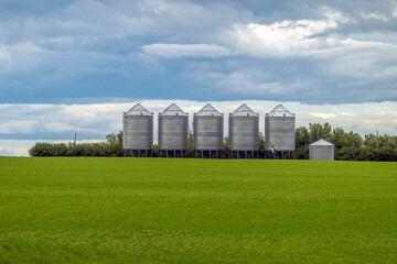 Some farm grain bins on a agriculture facility in Lethbridge, Alberta, Canada.
