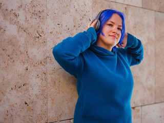 blue hair woman listening music