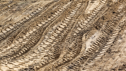 Dips in the ground from heavy road vehicles