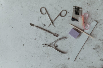 Manicure tools on a light grey background