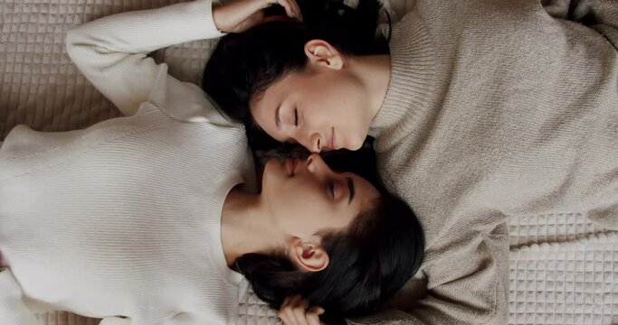 Couple, lgbt and lesbian women at home. Embrace and holding each other. Love and kiss, Pride Event, friendship concept. Romance and portrait of lesbian couple enjoying. LGBT rights, Lesbian family.