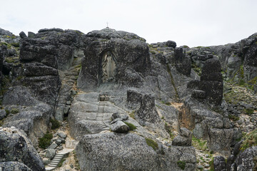 Fototapeta na wymiar Huge rock carved with the Our Lady of the Good Star, in Serra da Estrela Natural Park, Portugal 