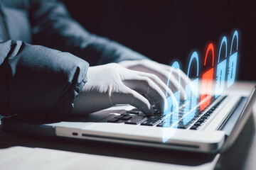 hacker man typing on laptop, hacking computer system. male in mask and pullover. unrecognizable...