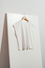 White women's t-shirt mockup template on wooden hanger