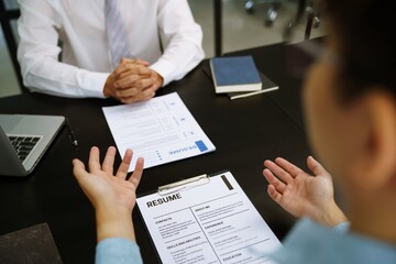 Team leader coach teach young workers explain on paper for business plan listen talkative coworker and discussing new project presentation Serious professional advisor consulting in office.