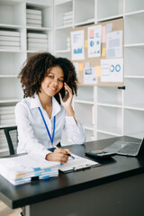 Business woman using tablet and laptop for doing math finance on an office desk, tax, report, accounting, statistics, and analytical research concept in office