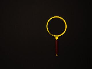 Magnifying glass isolated on a black background.